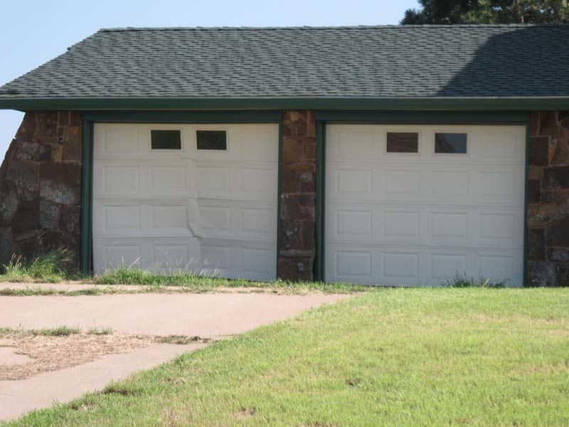 Garage door blown inward.