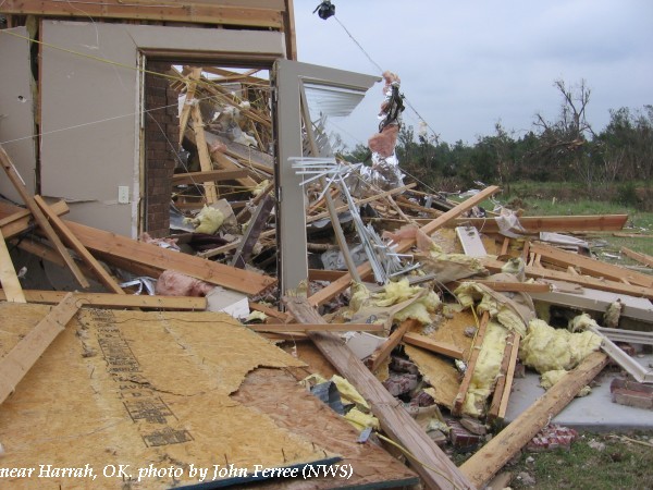 Damage to a home and trees near Harrah, OK.