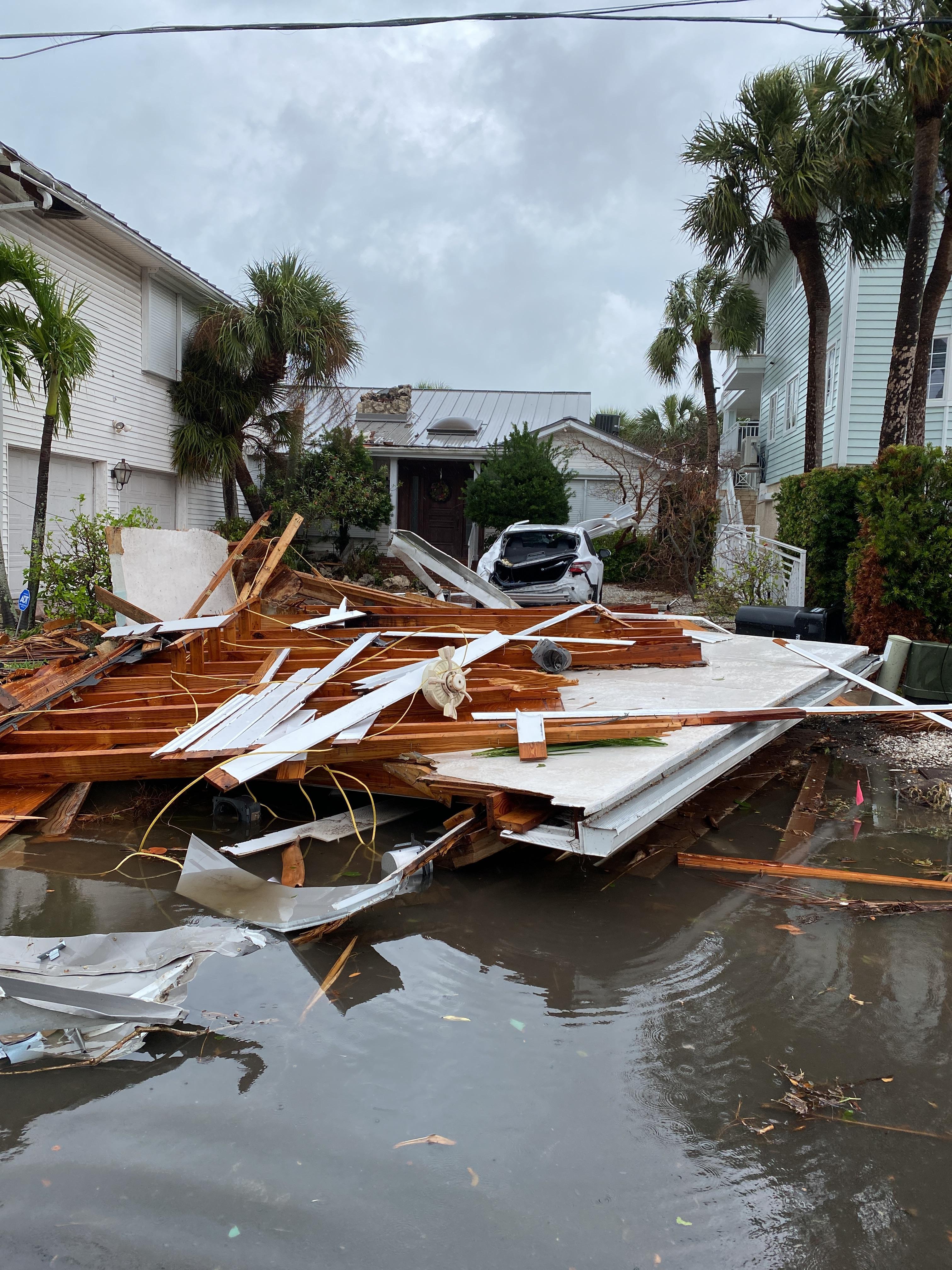 Picture of a porch ripped off and damaged car in Clearwater Beach