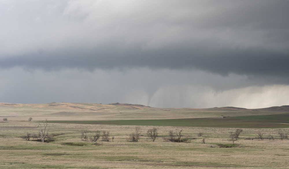 Intense thunderstorm with rain wrapping around a tornado