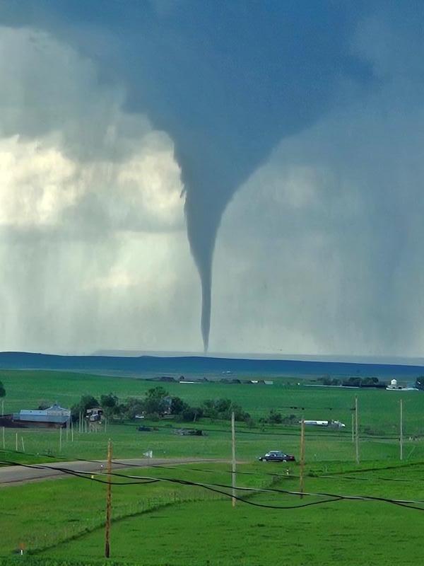 A tornado touches down in an open field near Faith, South Dakota