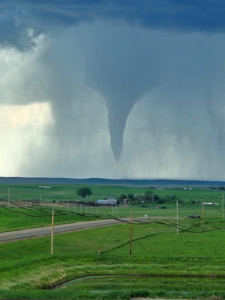 A tornado touches down in an open field near Faith, South Dakota